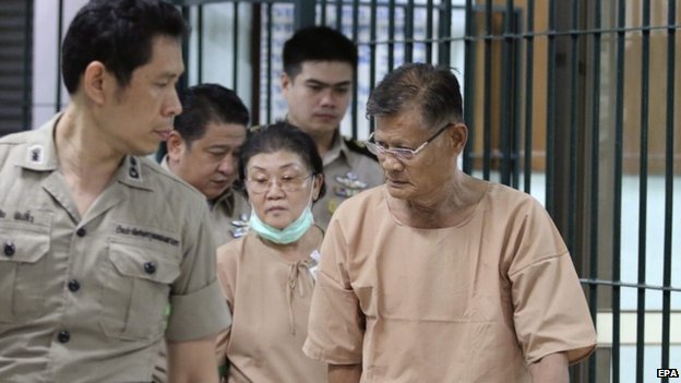 Alleged lese majeste guilty, parents of former royal consort princess Srirasm, Apiruj Suwadee (R) and his wife Wanthanee Suwadee (C) arrive the criminal court in Bangkok, Thailand, 11 March 2016.